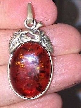 SS amber pendant with chain and matching earrings.