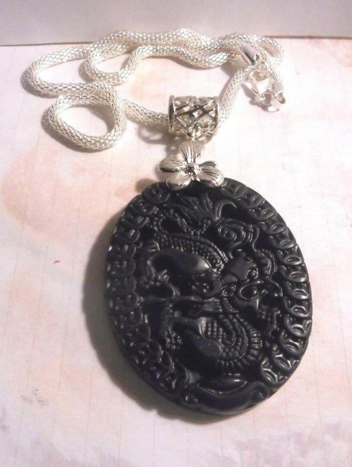 Black natural Artisan made real Jade dragon Chinese pendant on silver chain.