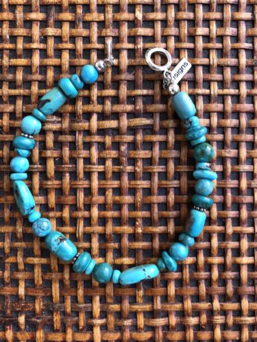 PAIGE WALLACE DESIGN TURQUOISE BRACELET. SEVERAL DIFFERENT STONES.