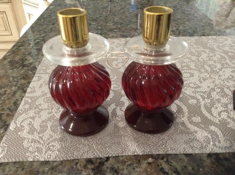 Vintage 2 Avon Cranberry glass candle sticks perfume bottles.