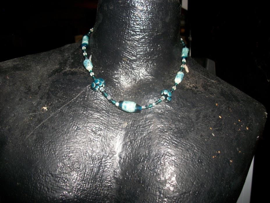 Teal beaded necklace featuring handmade artisan lampwork beads