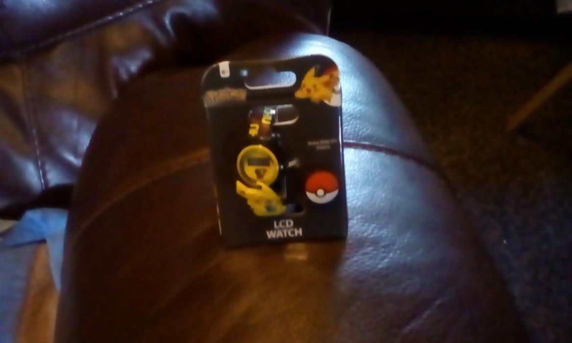 Pokemon  LCD watch with extra slide on charm new in the package