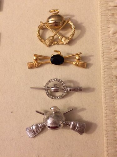 Lot Of Four Curling Brooches