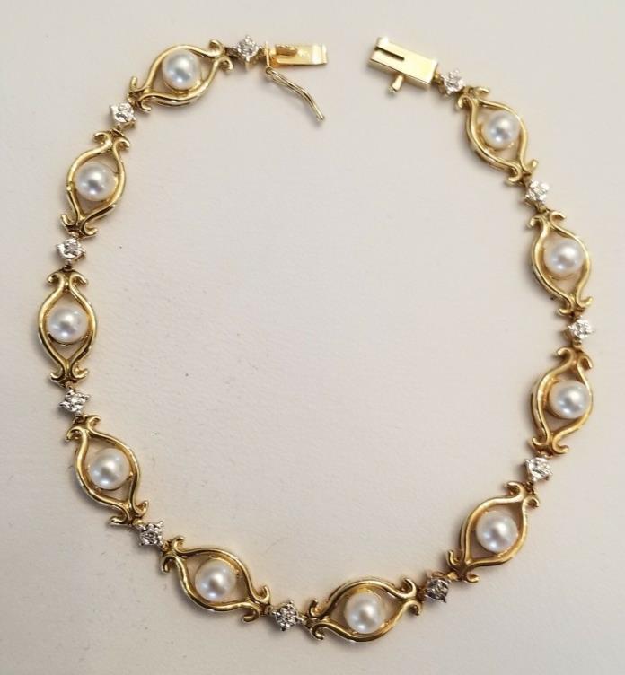 14KT Yellow Gold Bracelet w/ 10 Cultured Pearls, 11 diamonds, safety clasp, 7