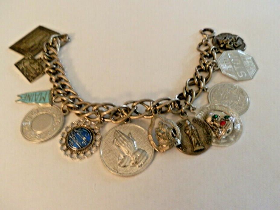 58.5 GRAMS STERLING SILVER CHARM BRACELET with 12 STERLING CHARMS