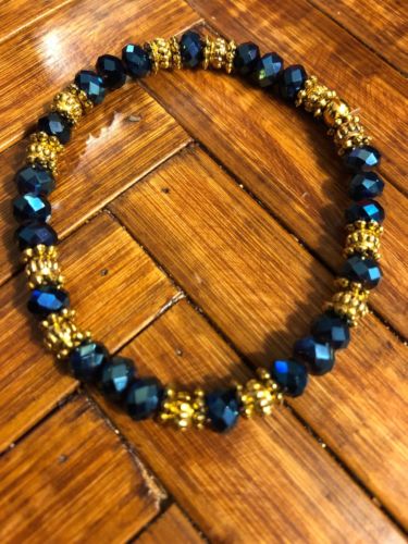 4x6mm Evening Blue Mirrored Glass Crystals & Bali Gold Beads. Stretch Bracelet