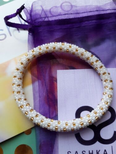 Sashka co bracelet white and gold roll on bracelet