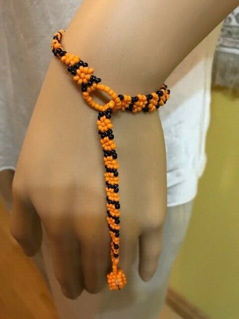 Handmade South African Beaded Bracelet.  Orange/Black.
