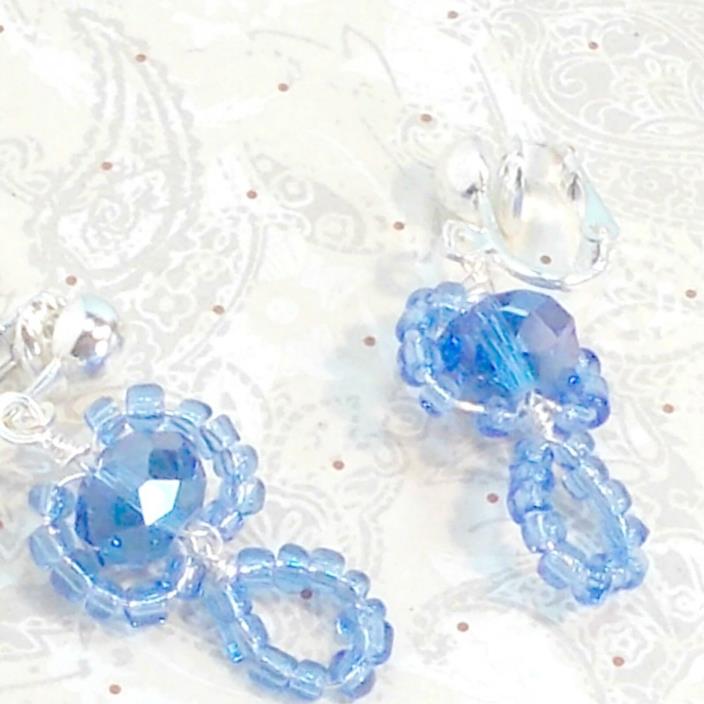 Earrings handmade clip on crystal surrounded by seed beads lt blue Pat2