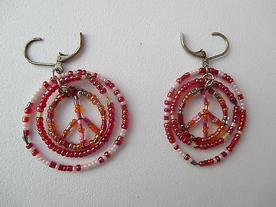 Pair of red, pink and white Peace Sign bead earrings by Aid Through Trade