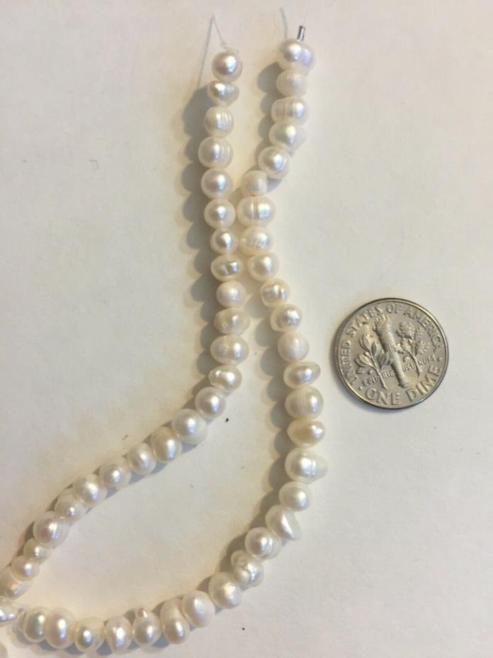 two strands of white freshwater pearl beads