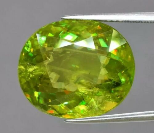 15.57 Carat Oval Natural Yellowish Green Sphene/ Titanite, Great For Collection