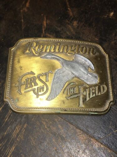 VINTAGE REMINGTON BELT BUCKLE - FIRST IN THE FIELD