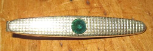 VINTAGE GOLD TONE METAL WITH GREEN GLASS STONE TIC CLIP