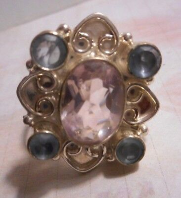 Silver ring with Aquamarine round cur 4 small and Tourmaline stone 1 2 carats??