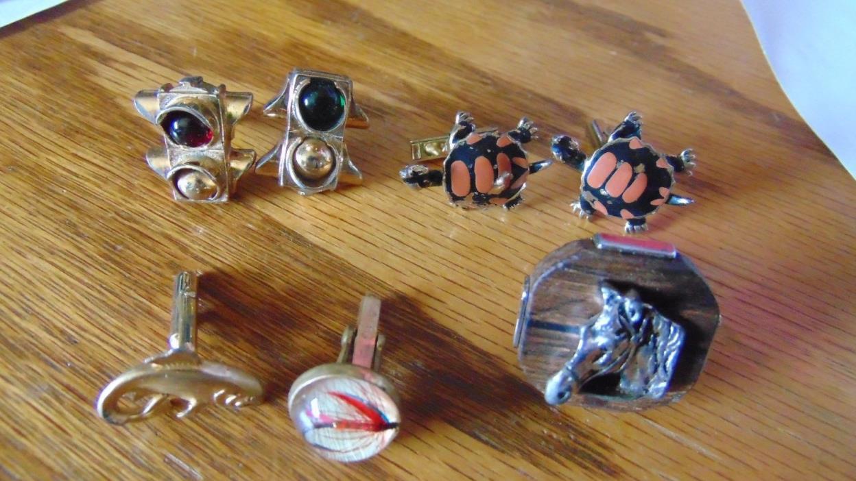 Lot of vintage cuff links or tie clips.
