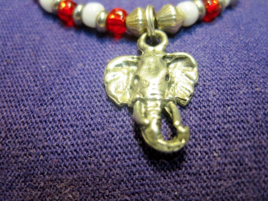 older costume bracelet, tusked elphant head pendant
