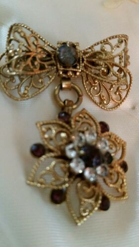 Antique Bow dangling star flower pin 1-1/2 inch. Gold wash with stones.