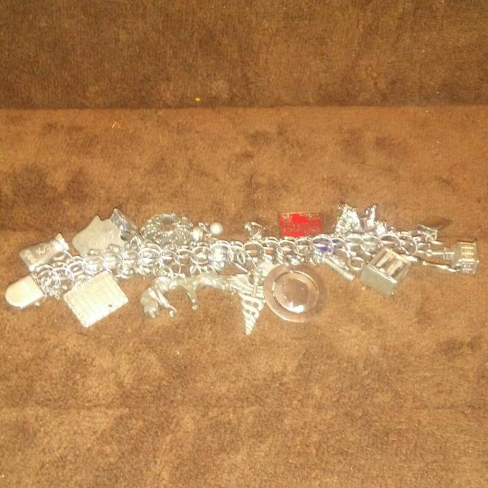 Vintage Sterling Silver Charm Bracelet with 24 Charms 86.6 grams 1960's