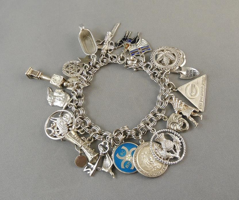 VINTAGE STERLING SILVER CHARM BRACELET 24 CHARMS 65 GRAMS 7 1/4 INCHES