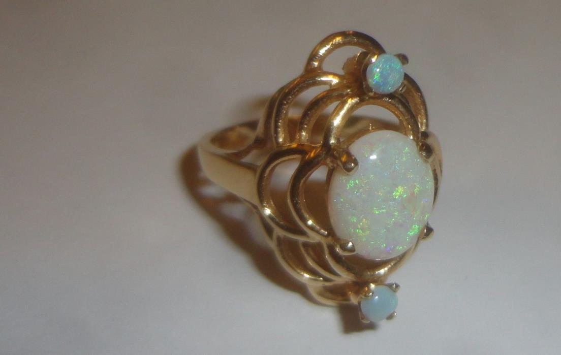 LADIES 14 KARAT YELLOW GOLD OPAL RING WITH CENTER OPAL &  2 OTHER, SIZE 7 1/2