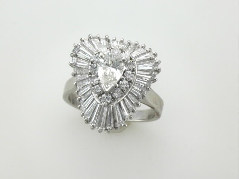 Pear shape, round and baguette diamond ring in platinum. 2.66 carats estimated