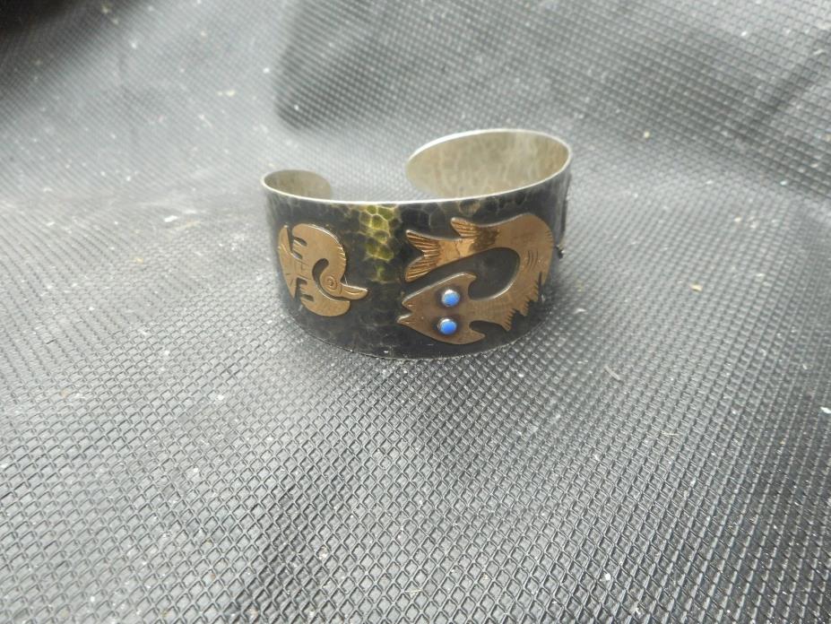 Sterling and 18 kt. Gold Hammered Cuff.