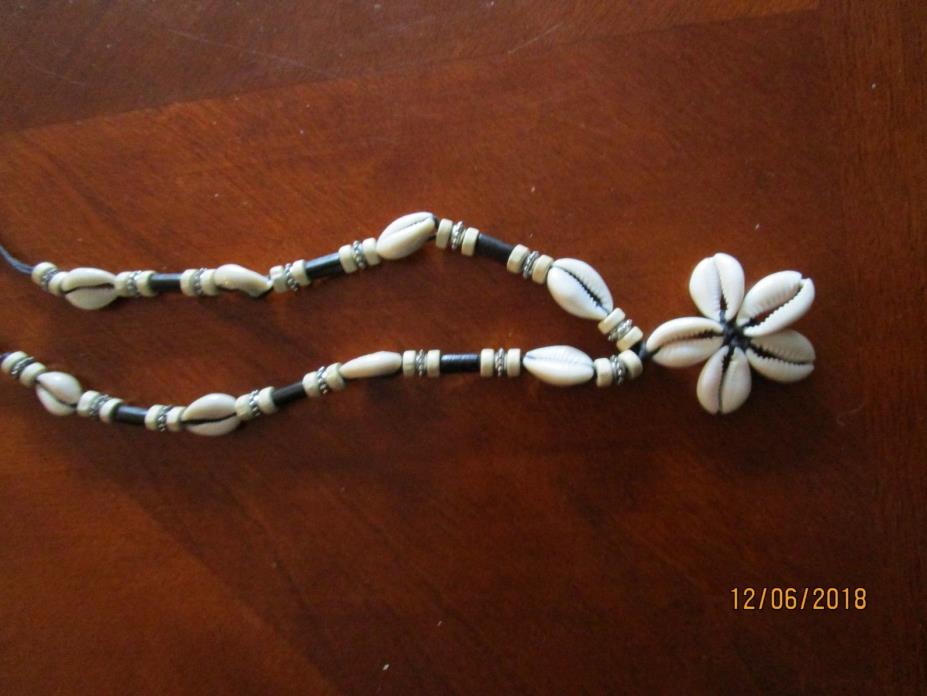 vintage cowrie shells on knotted wax cord necklace with cowrie star design