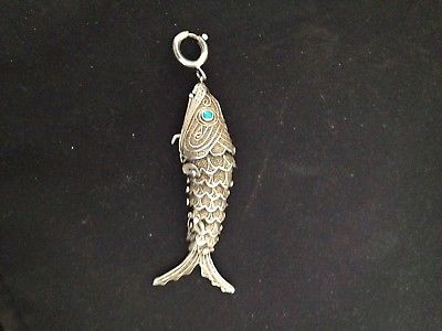 SILVER ARTICULATED FISH W/TURQUOISE EYES