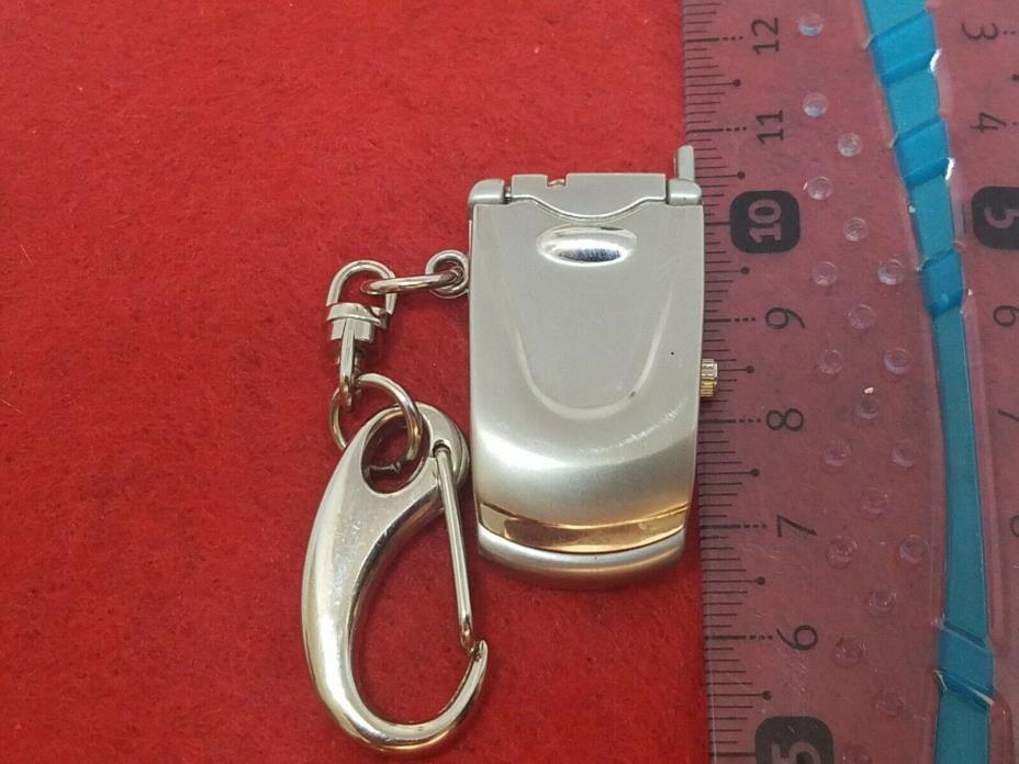 VINTAGE CELL FLIP PHONE WATCH SILVER MOTOROLA DESIGN WORKING ORDER NEW BATTERY