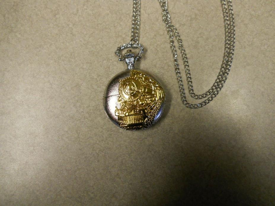 TRAIN THEME GOLD AND SILVER COLORED POCKET WATCH