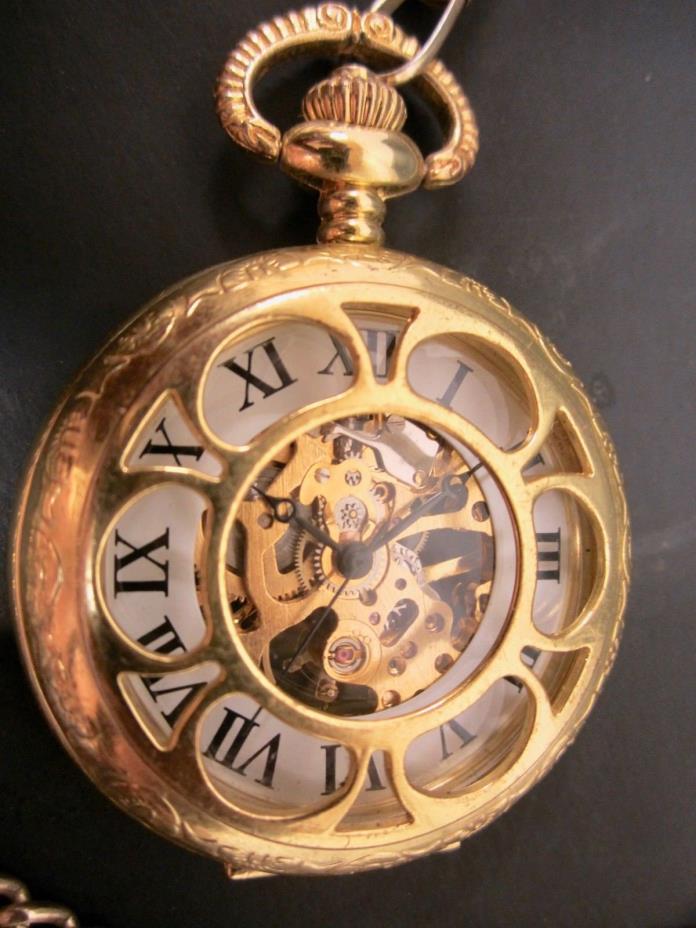 beautiful wind up pocket watch with cutouts brass? Gold filled? No brand