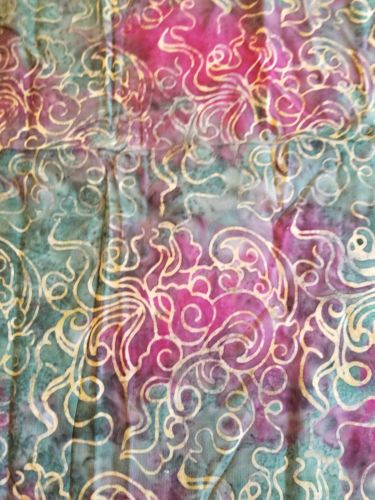 1.5 yards purple and green batik fabric with swirl pattern throughout