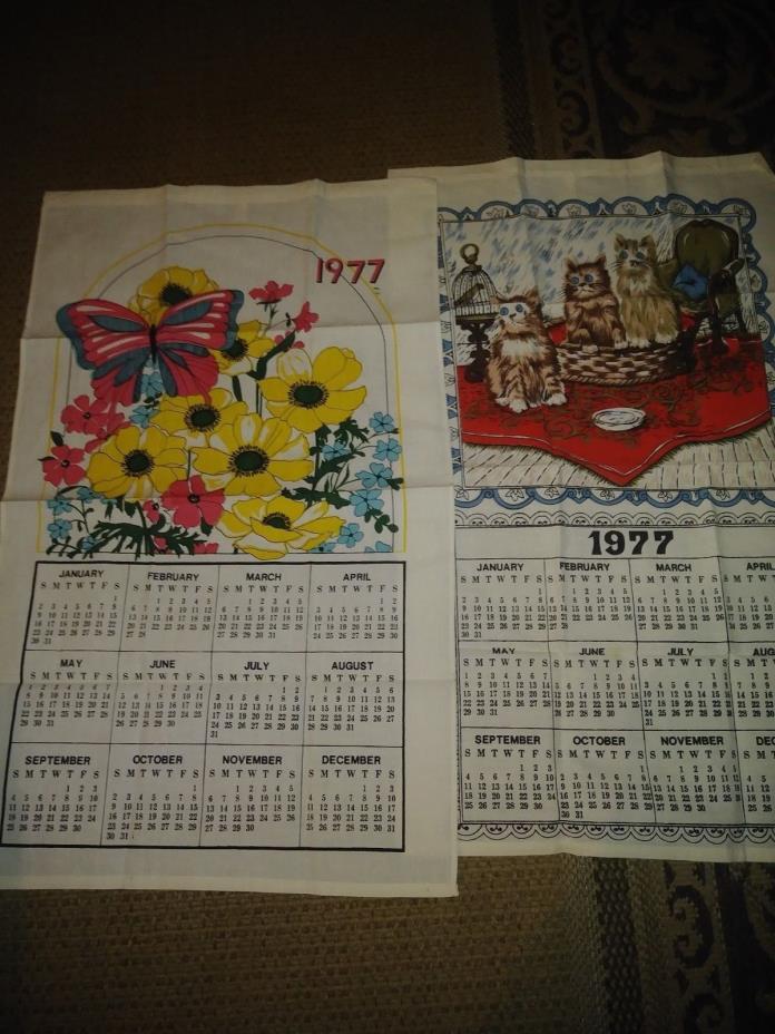 Lot of TWO vintage 1977, calenders printed on fabric with floral and cat detail
