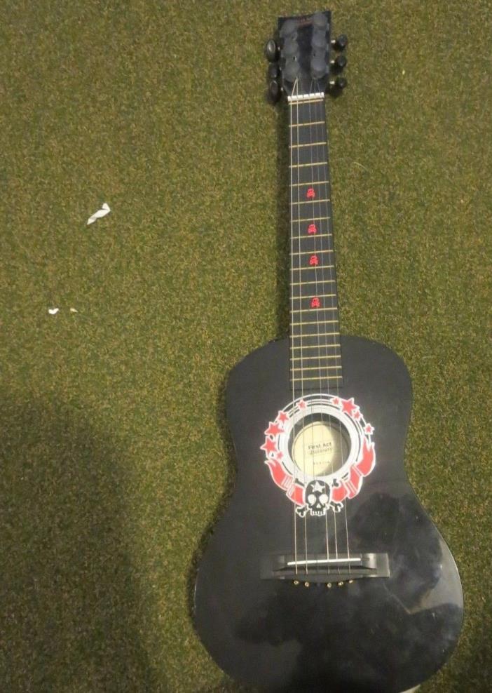 FIRST ACT BLACK GUITAR WITH SKULLS DESIGN