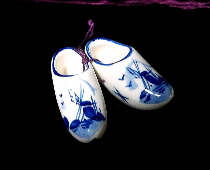 A Miniture Set of Porcelain Decoritive Cobolt Blue & White Shoes