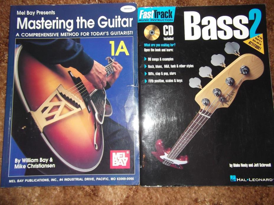 Set of 2 Guitar Books..Masteirng the Guitar and Fast track Bass Method