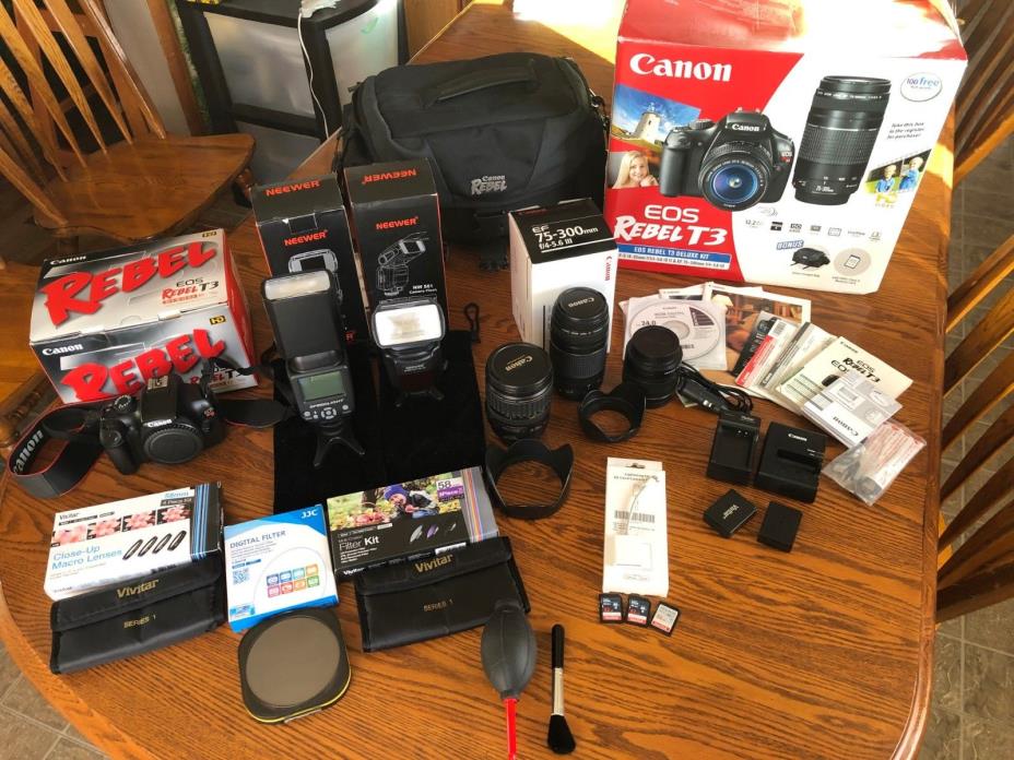 Canon EOS Rebel t3 Deluxe Kit Bundled with 18-55mm, 75-300mm, and 28-135mm +more