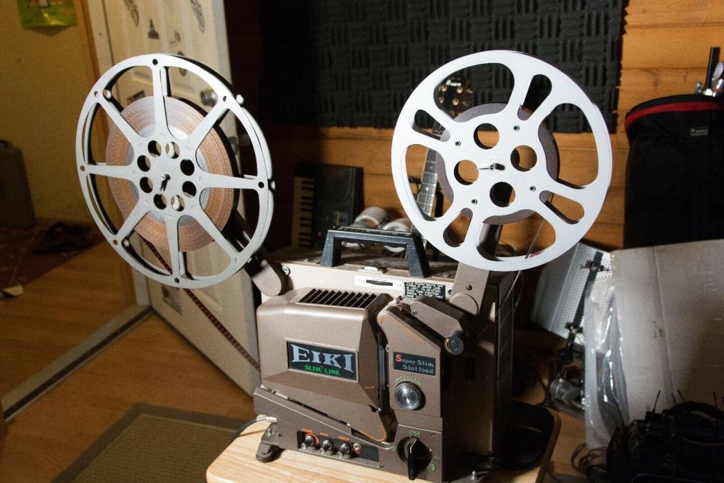 Eiki 16mm Projector with 13 Films