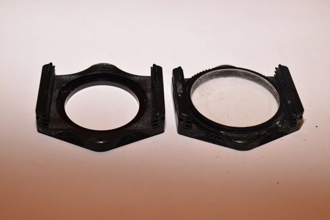 Two small Cokin Filter Holders with a 49mm Adapter Ring
