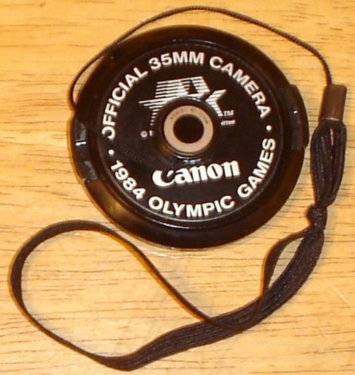 Canon Official 35mm Camera 1984 Olympic Games 52mm Lens Cap w/ Strap - Near-Mint