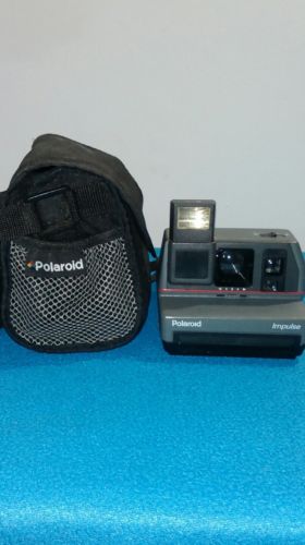 Polaroid Impulse 600 Instant Film Camera Built-In Flash with carrying case.