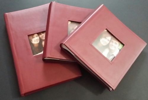set of three maroon photo albums