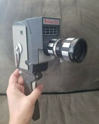 VINTAGE MANSFIELD HOLIDAY REFLEX ZOOM 8 MM MOVIE CAMERA W/FILM NOT SURE WHATS ON