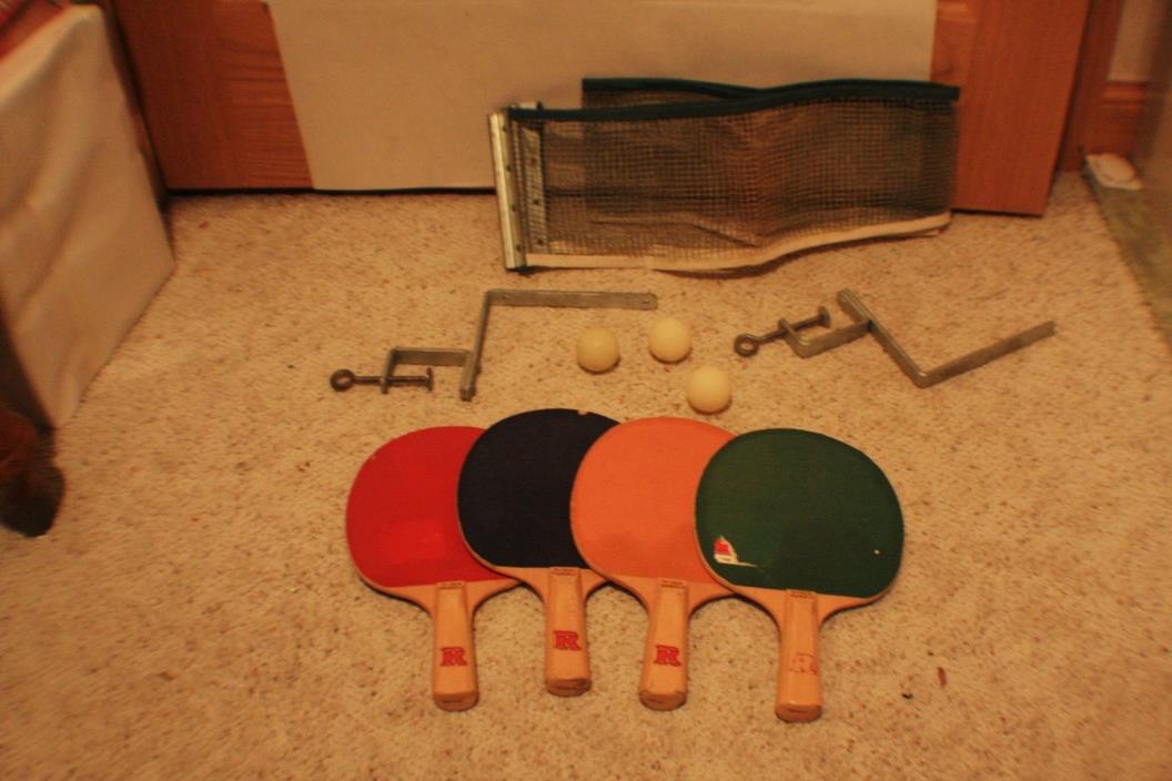 Vintage ping pong set with accessories: 4 Paddles, one net and  3 balls.