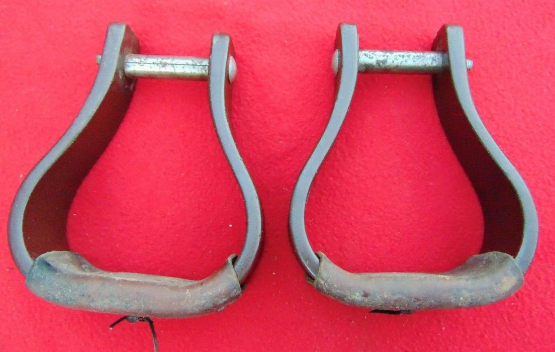 HORSE STIRRUPS ~ PLASTIC WITH HEAVY LEATHER LACED ONTO FOOT ~ USED
