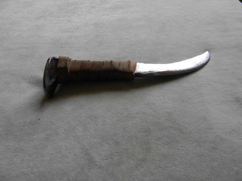 railroad spike knife, leather handle, steel blade.