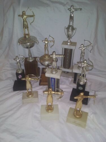 Collection of 11 vintage womens archery trophies