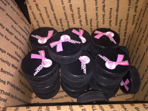 Hockey East  Hockey Pucks New  Lot Of 34  In glas  Official  Pink