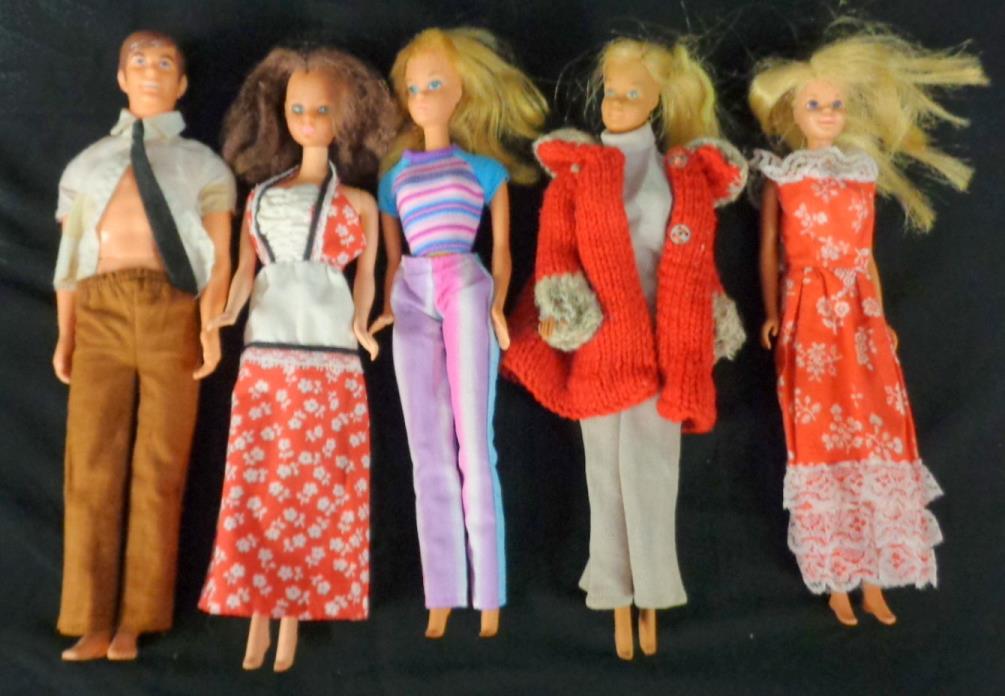 4 1966 Barbie dolls & 1 1967 KEN DOLL WITH CLOTHES ON